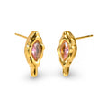 A pair of gold stud earrings with an organic, melting-puddle shape and a marquise-cut pink gemstone in the center, shown on a clean white background.