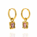 A pair of gold hoop earrings with a small, textured gold rectangular bezel setting holding a cubic zironia marquise-cut gemstone. 